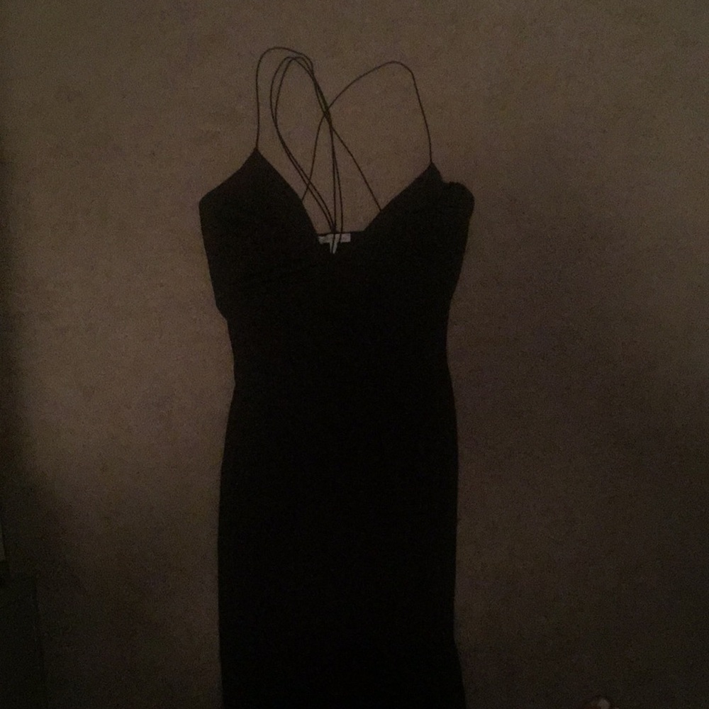 Sleek strappy black dress with high slit
